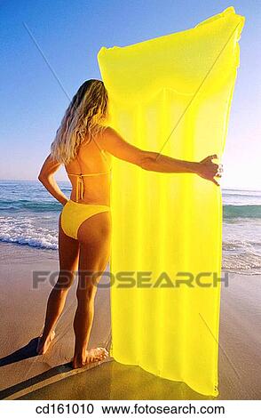Stock Image - air-bed, beach, back view, air mattress. Fotosearch