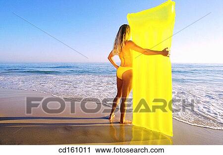 Stock Image - air-bed, beach, back view, air mattress. Fotosearch