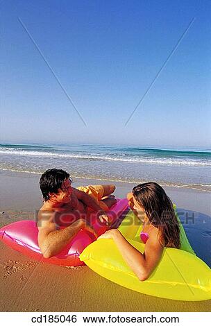 Stock Photograph - air-bed, Best friend, beach, attraction, air mattress. Fotosearch