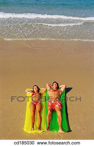 air-bed, brunette, beach, air mattress View Large Photo Image Stock Image - air-bed, brunette, beach, air mattress. Fotosearch