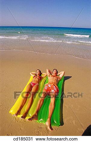 air-bed, brunette, beach, air mattress View Large Photo Image Stock Image - air-bed, brunette, beach, air mattress. Fotosearch