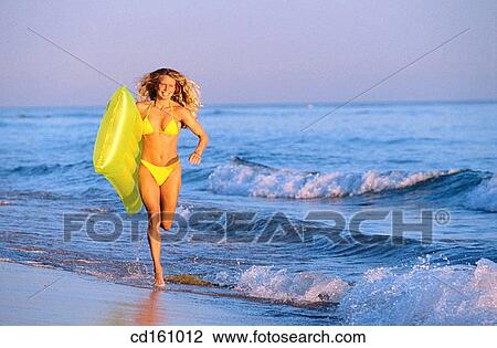 Stock Image - air mattress, beach, air-bed, activity. Fotosearch