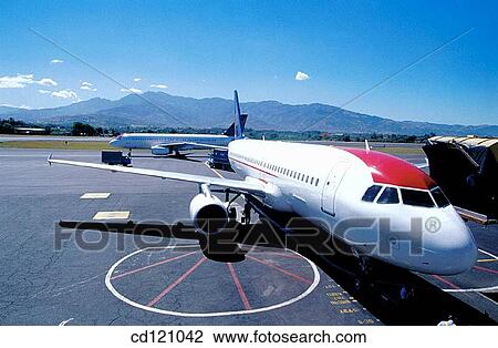 Airplane at airport of San Jose. Costa Rica View Large Photo Image Stock Image - Airplane at airport of San Jose. Costa Rica. Fotosearch