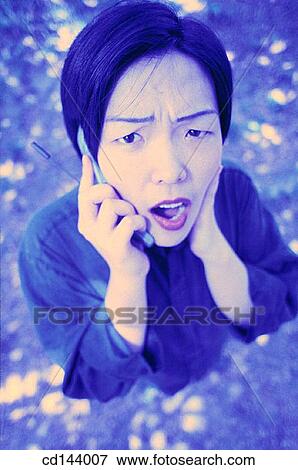 Stock Photo - amazement, astonished, Asian-American, Asian, amazed. Fotosearch