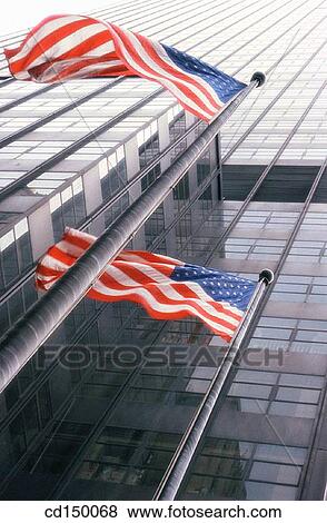 Stock Photo - American flag, city, building, Americana, America. Fotosearch
