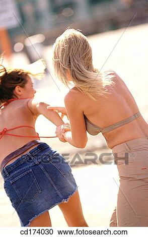 amusement, beach, bathing-suit, back view, adolescence View Large Photo Image Stock Image - amusement, beach, bathing-suit, back view, adolescence. Fotosearch