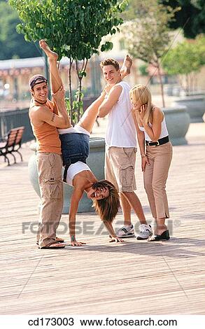 Stock Image - amusement, blond, black hair, Best friend, activity. Fotosearch
