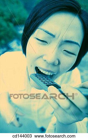 Stock Image - anxious, bite, Asian-American, Asian, anxiety. Fotosearch