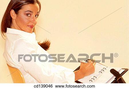 Stock Photograph - arrogance, brunette, askance, arrogant, agenda. Fotosearch