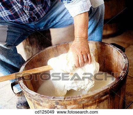 Artisan preparing sicilian cheese (caciocavallo) View Large Photo Image Stock Photo - Artisan preparing sicilian cheese (caciocavallo). Fotosearch
