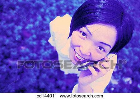 Asian-American, cell phone, carefree, calling, Asian View Large Photo Image Stock Image - Asian-American, cell phone, carefree, calling, Asian. Fotosearch