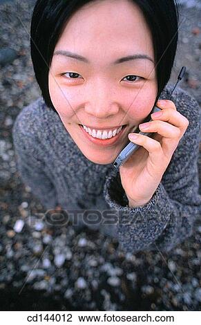 Asian-American, cell phone, carefree, calling, Asian View Large Photo Image Stock Image - Asian-American, cell phone, carefree, calling, Asian. Fotosearch