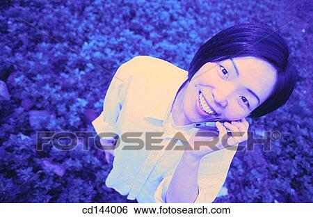 Asian-American, cell phone, carefree, calling, Asian View Large Photo Image Stock Photograph - Asian-American, cell phone, carefree, calling, Asian. Fotosearch