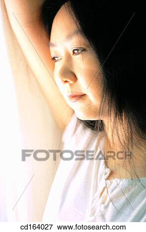 Asian-American, contemplate, absorbed View Large Photo Image Stock Photo - Asian-American, contemplate, absorbed. Fotosearch