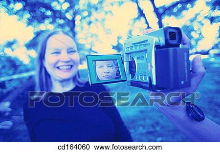 baby boomer, blond, camcorder, carefree View Large Photo Image Stock Image - baby boomer, blond, camcorder, carefree. Fotosearch