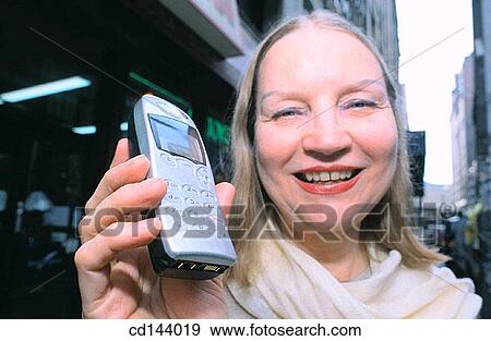 baby boomer, blond, cell phone, city View Large Photo Image Stock Photo - baby boomer, blond, cell phone, city. Fotosearch