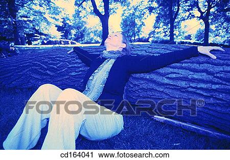 Stock Image - baby boomer, carefree, calm, Arms open. Fotosearch