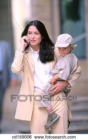 Stock Photograph - baby, boy, calling, cell phone. Fotosearch