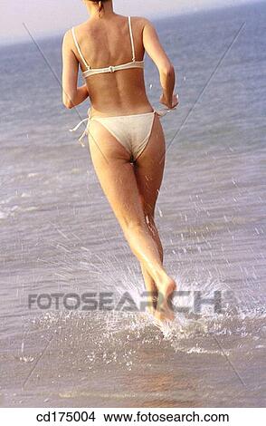 back view, beach, bathing-suit, barefoot, activity View Large Photo Image Picture - back view, beach, bathing-suit, barefoot, activity. Fotosearch