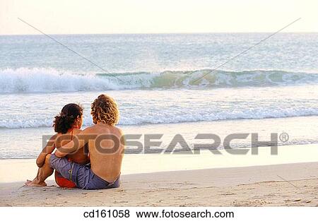 Stock Photo - back view, beach, Best friend, bond, bonding. Fotosearch