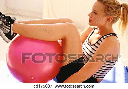 Stock Photo - ball, calisthenics, blond, activity. Fotosearch