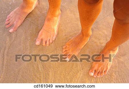 Stock Photo - barefoot, bathe, bathing, beach, contemporary. Fotosearch