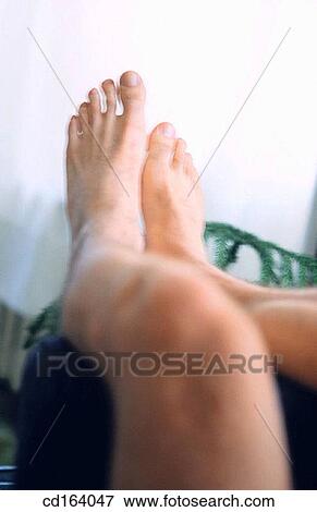 Stock Photo - barefoot, body, Body part, chilling out. Fotosearch