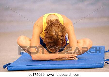 Stock Photo - beach, calisthenics, concentrate. Fotosearch