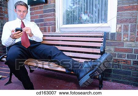 Stock Photo - bench, business, businessman, businesspeople. Fotosearch