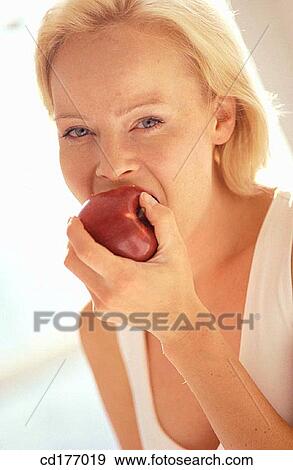 bite, blond, biting, apple View Large Photo Image Stock Photo - bite, blond, biting, apple. Fotosearch