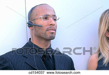 Black executive with headset View Large Photo Image Stock Photo - Black executive with headset. Fotosearch