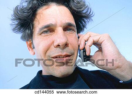 Stock Photography - black hair, calling, cell phone, Close-up. Fotosearch