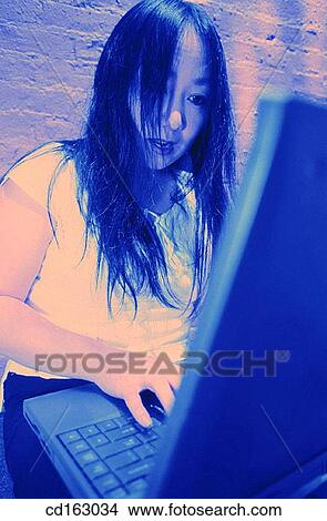 Picture - blue, businesswoman, businesspeople, business, Asian-American. Fotosearch