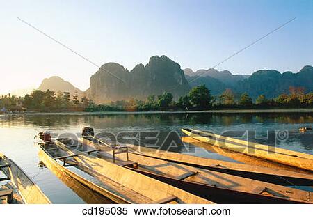 Boats at Nam Song River. Vang Vieng. Laos View Large Photo Image Stock Photography - Boats at Nam Song River. Vang Vieng. Laos. Fotosearch