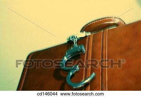 Briefcase and handcuffs View Large Photo Image Picture - Briefcase and handcuffs. Fotosearch