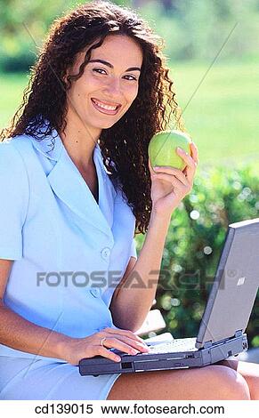 Stock Photography - brunette, businesswoman, businesspeople, business, apple. Fotosearch