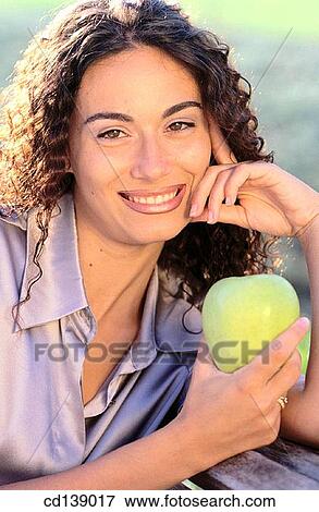 brunette, Close-up, apple View Large Photo Image Stock Photo - brunette, Close-up, apple. Fotosearch