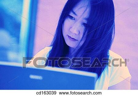 Stock Photo - business, businesswoman, businesspeople, Asian-American. Fotosearch