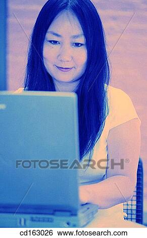 Stock Photograph - business, businesswoman, businesspeople, Asian-American. Fotosearch