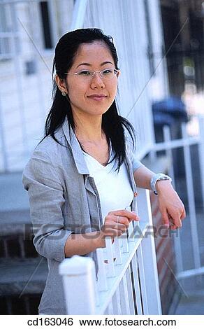 Stock Photograph - business, businesswoman, businesspeople, Asian-American. Fotosearch
