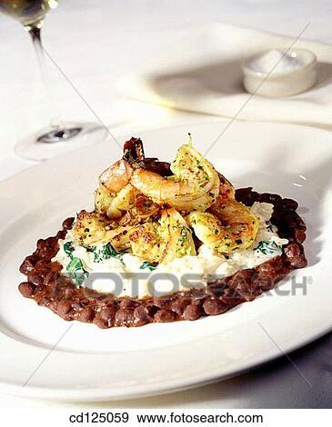 Catalan shrimp on a bed of white rice and beans View Large Photo Image Stock Photo - Catalan shrimp on a bed of white rice and beans. Fotosearch