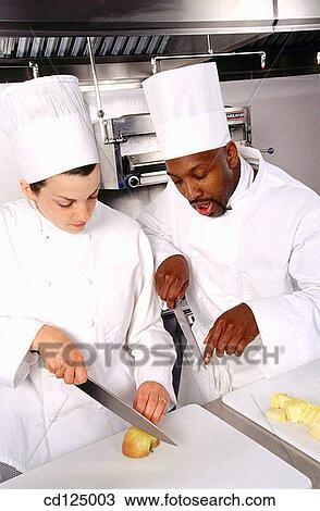 Stock Image - Chef and trainee. Fotosearch