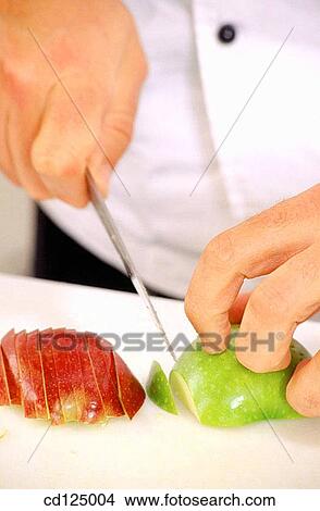 Chef cutting an apple View Large Photo Image Picture - Chef cutting an apple. Fotosearch