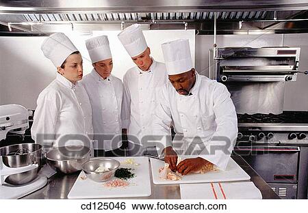 Chef with trainees View Large Photo Image Stock Photograph - Chef with trainees. Fotosearch