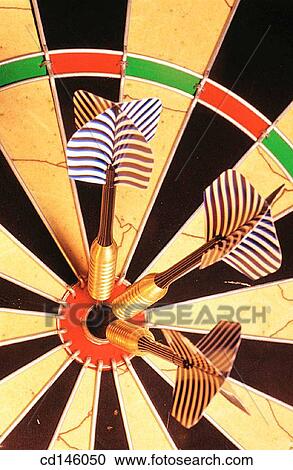 Darts in bullseye on dartboard View Large Photo Image Stock Image - Darts in bullseye on dartboard. Fotosearch