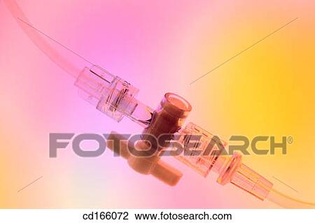 Stock Image - IV tubing valve. Fotosearch