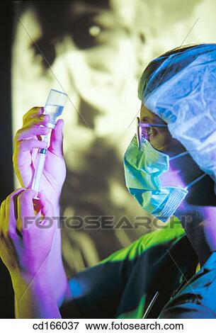 Nurse and syringe View Large Photo Image Stock Photo - Nurse and syringe. Fotosearch