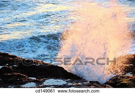 Ocean waves breaking on rocks. View Large Photo Image Stock Image - Ocean waves breaking on rocks.. Fotosearch