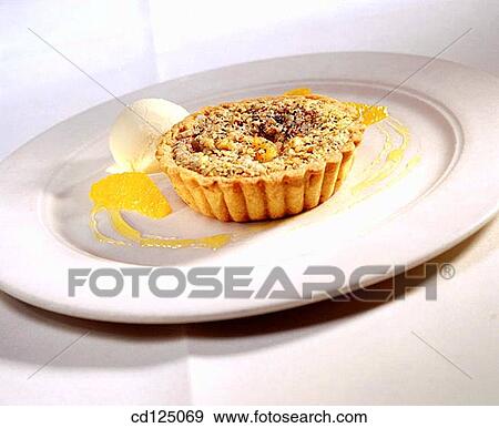 Orange pecan tart with ice cream View Large Photo Image Stock Photo - Orange pecan tart with ice cream. Fotosearch