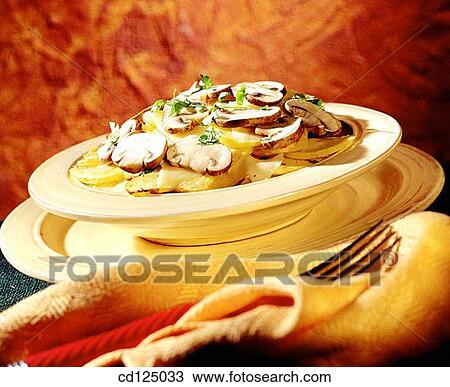 Potatoes with parmesan cheese View Large Photo Image Stock Image - Potatoes with parmesan cheese. Fotosearch